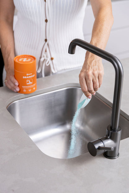 Pouring DRAINZAP into a blocked kitchen sink drain